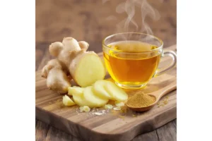 Fresh ginger root being sliced, with ginger tea steaming, and ginger powder 